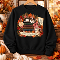 Grace Upon Grace sweatshirt front design with books florals and warm drinks